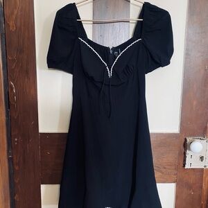 Elegant Black Dress with White Trim and puffers sleeves